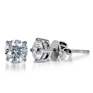 The Solitaire Round Brilliant Stud Earrings is crafted in 14K White Gold and each piece features a single round brilliant diamond -- one piece in 1.01-carat with size 6.2x6.3x4.1mm; and the other in 1.00-carat with size 6.2x6.3x4mm with clarity grading of VVS1 and both in the color G.  Natural Stud Earring