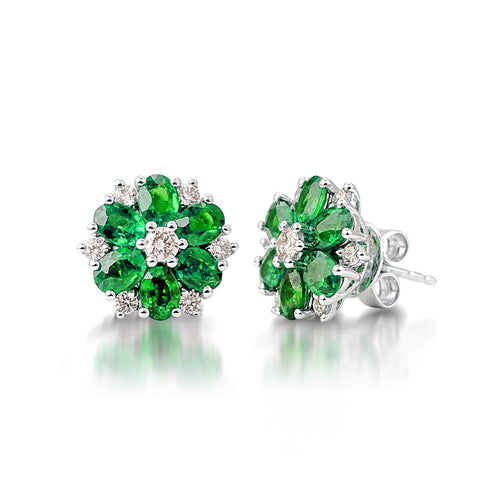 The Flower Shaped Emerald Earrings are crafted in 14K white gold featuring 2 pieces of 1.69-carat emerald stones and 14 pieces of 0.41-carat diamonds in total carat weight. Clarity is VS-SI1 and Color is G to H.